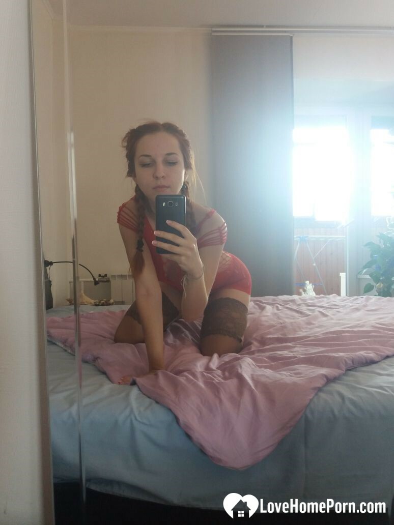 Smoking redhead teases in stockings in the bedroom — 60